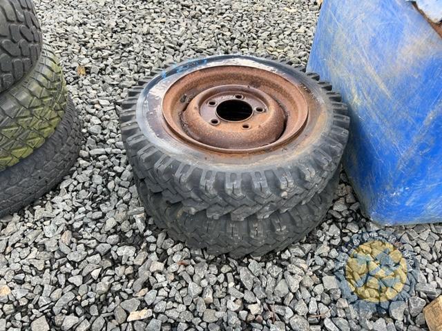 2 old trailer wheels