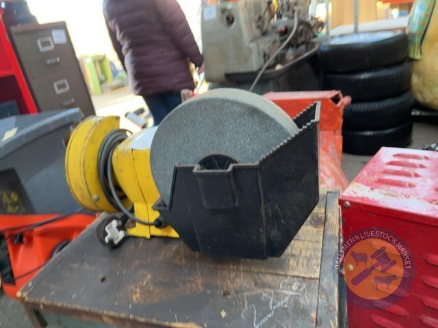 Bench grinder on table