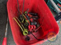 Red bucket of tines