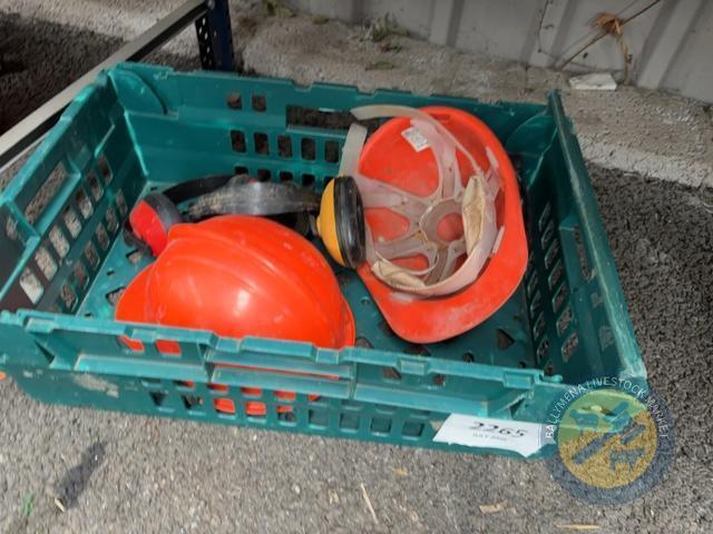 Green trolly of hard hats & ear muffs