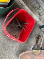 Red bucket of rotavator blades