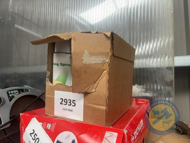 Box of green marking spray