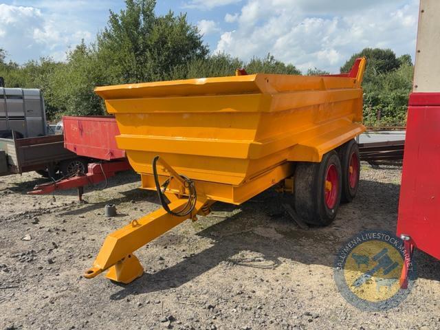Yellow dump trailer with red door repsprayed